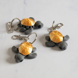 Flexi Skildpadde nøglering - Grå/guld