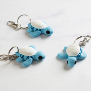 Flexi Skildpadde nøglering - Lyseblå/hvid