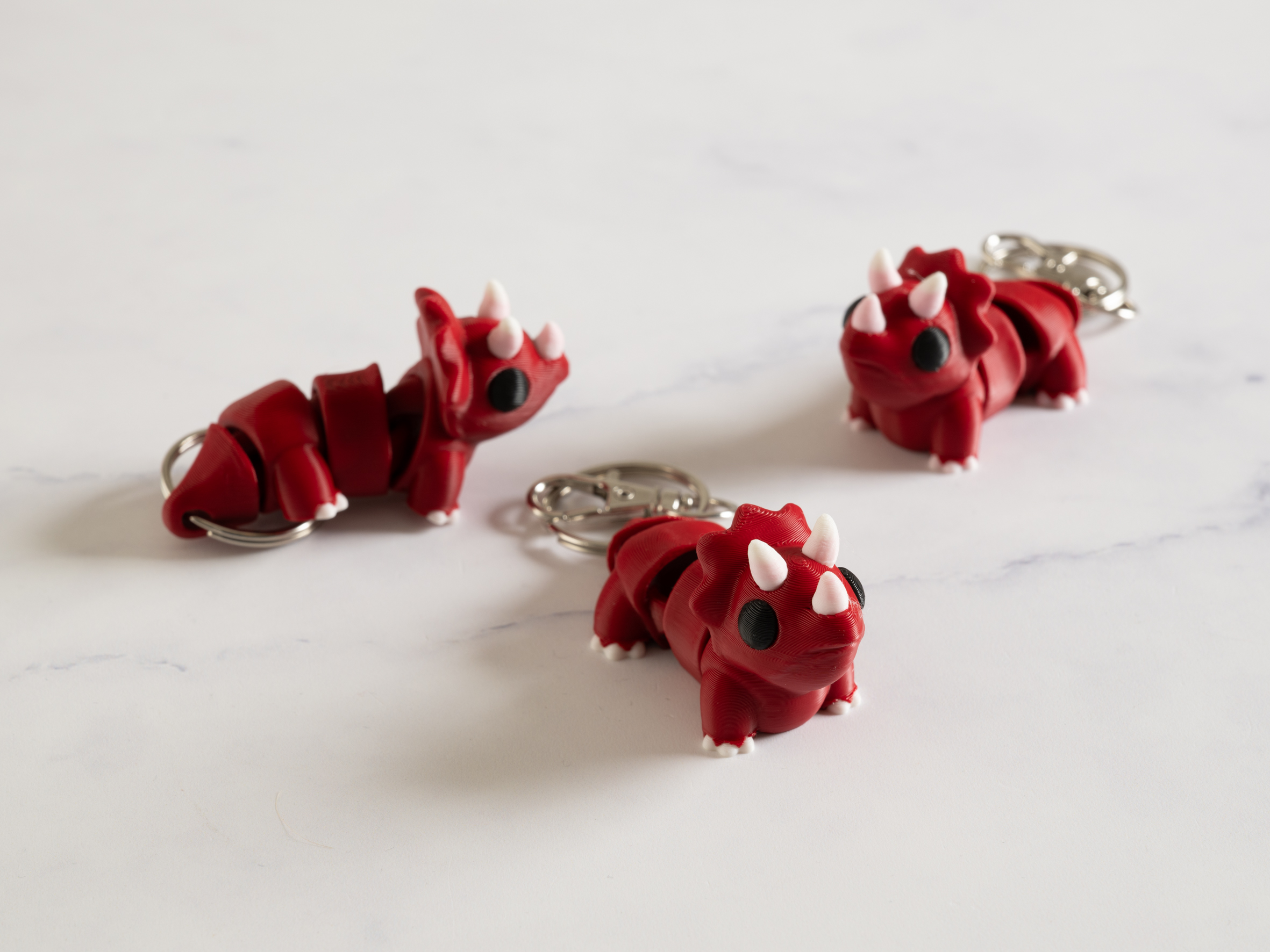 Flexi Triceratops nøglering – Mørk rød